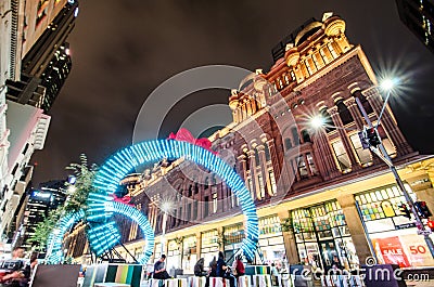 Night photography of Georges street with beautiful Christmas artwork sparkle light installation with Queen Victoria building. Editorial Stock Photo